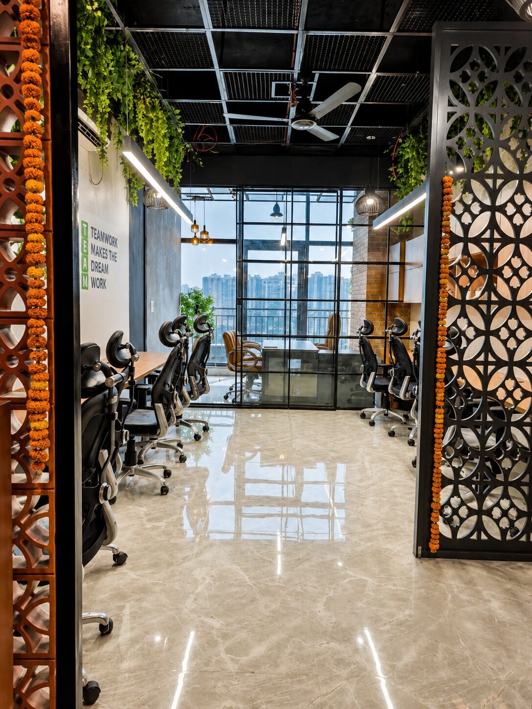 Finished coworking office floor with workstations and exposed black ceiling