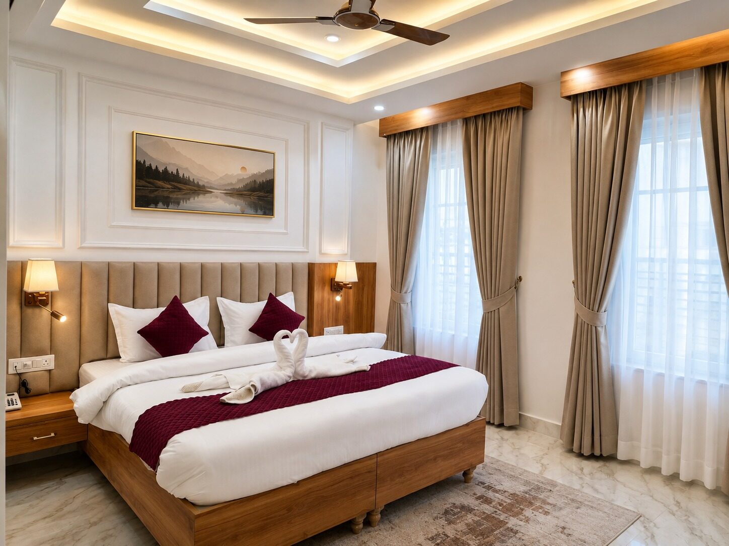 Finished living room with a circular crystal chandelier and beige upholstered sofas