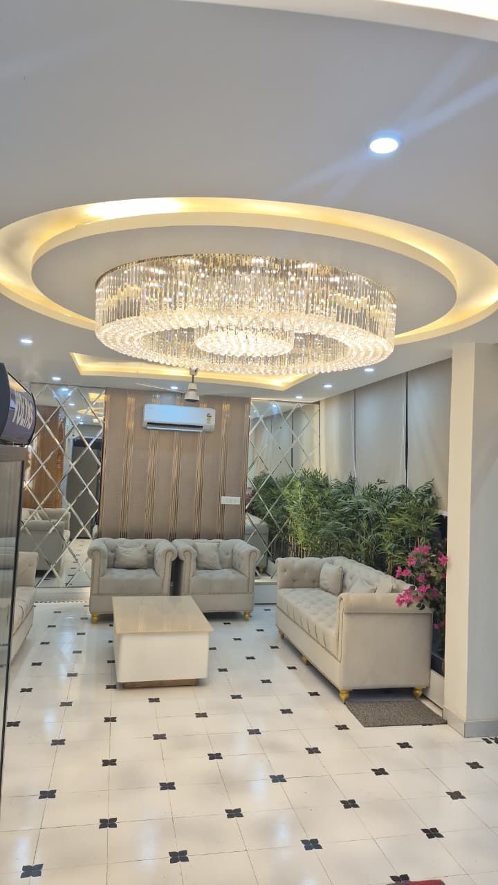 Wide view of the hotel lobby with feature ceiling and seating