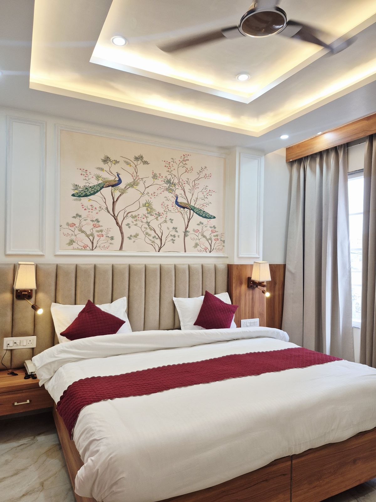 Hotel guest room with a hand-painted mural wall