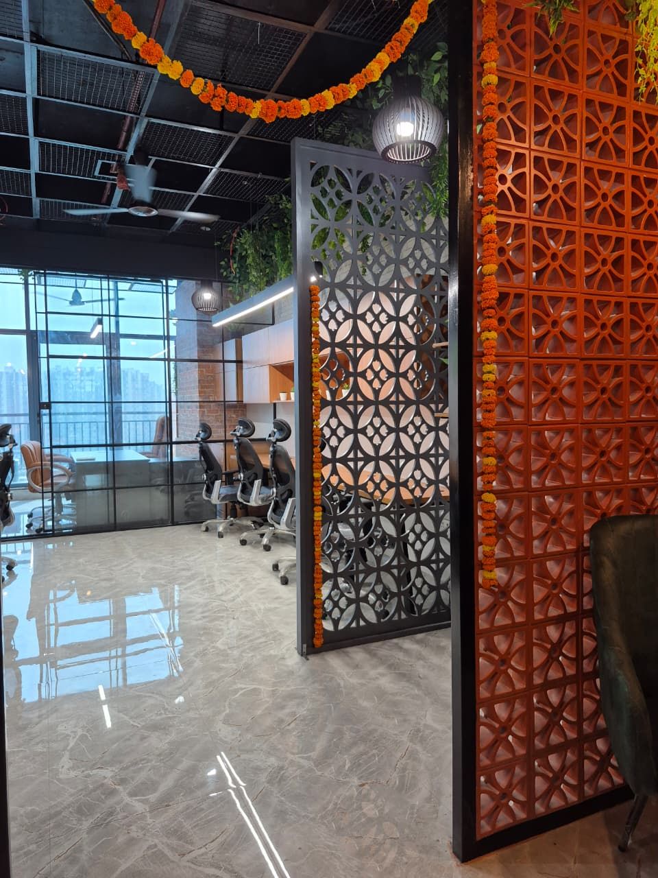 Glass-fronted manager cabin with a linear light fitting