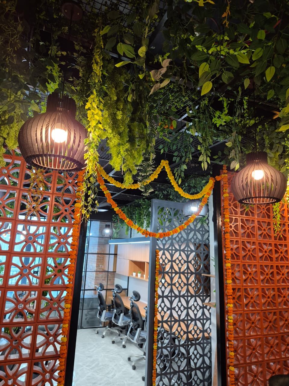 Biophilic wall with hanging planters and stone cladding